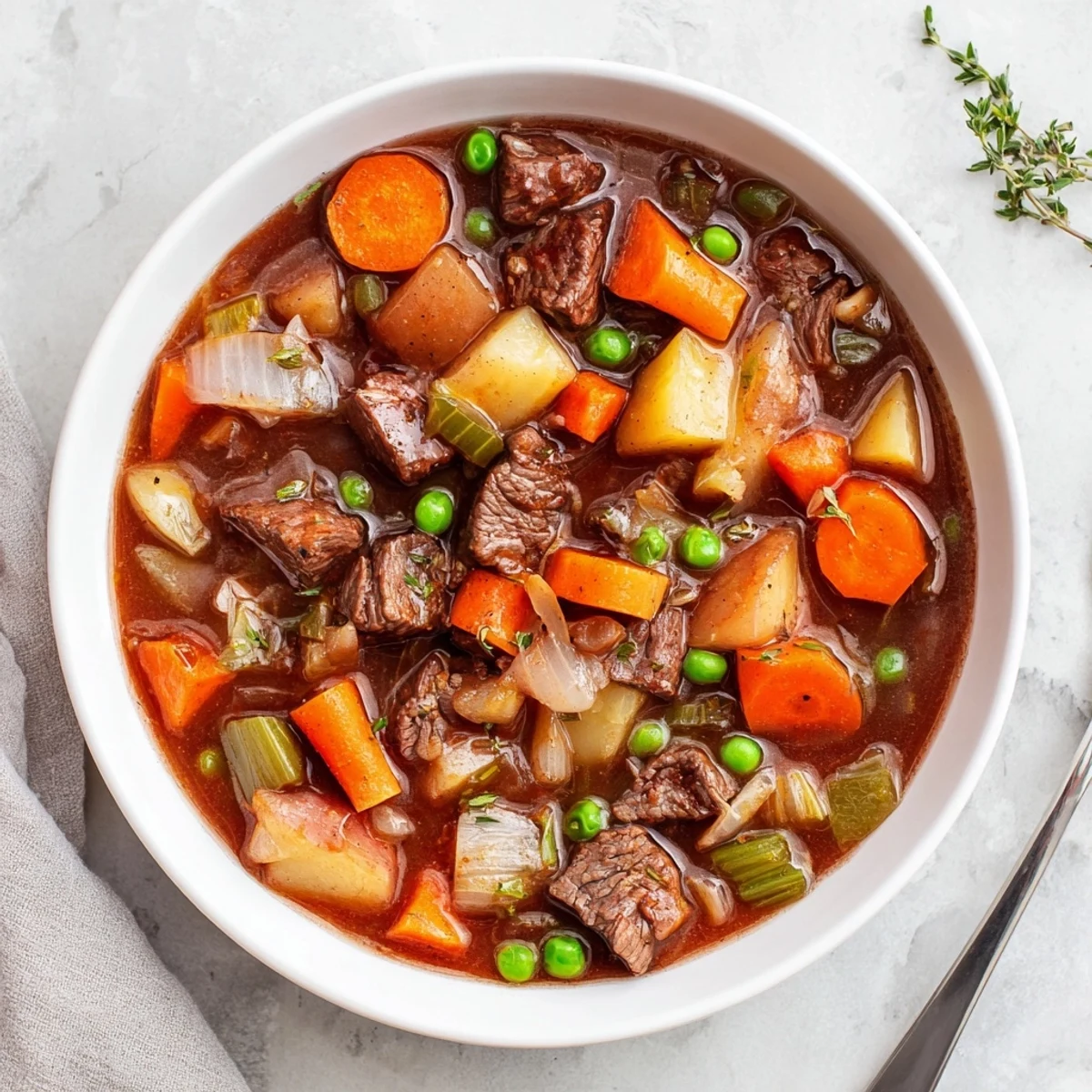 Freshly cooked Slow Cooker Beef and Vegetable Stew served from the slow cooker, with steam rising over hearty vegetables and tender meat.