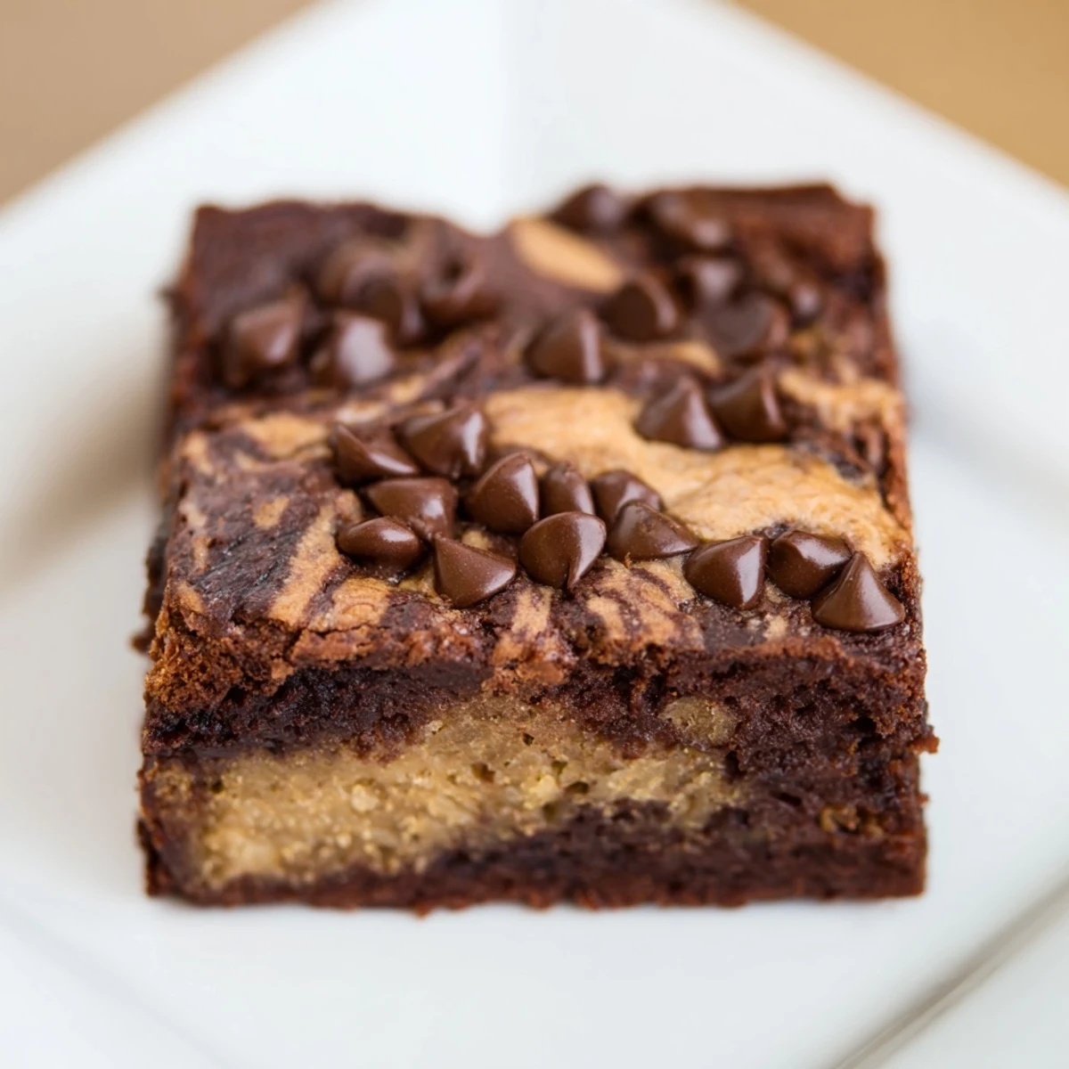 Rich fudgy brownie layer swirled with sweet banana bread batter in a baking pan