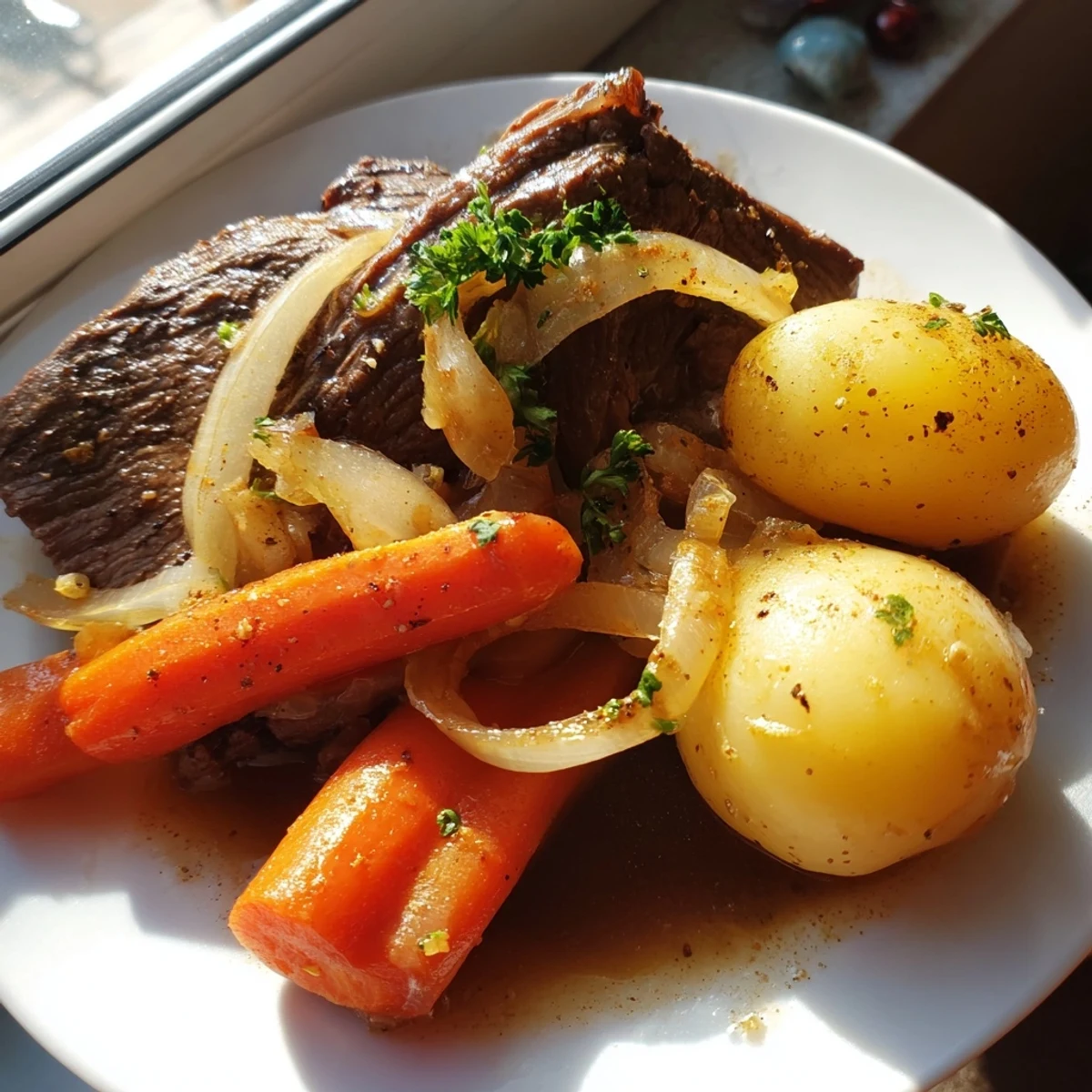 Hearty slow cooker steak and potatoes with carrots and onions in a savory beef broth sauce