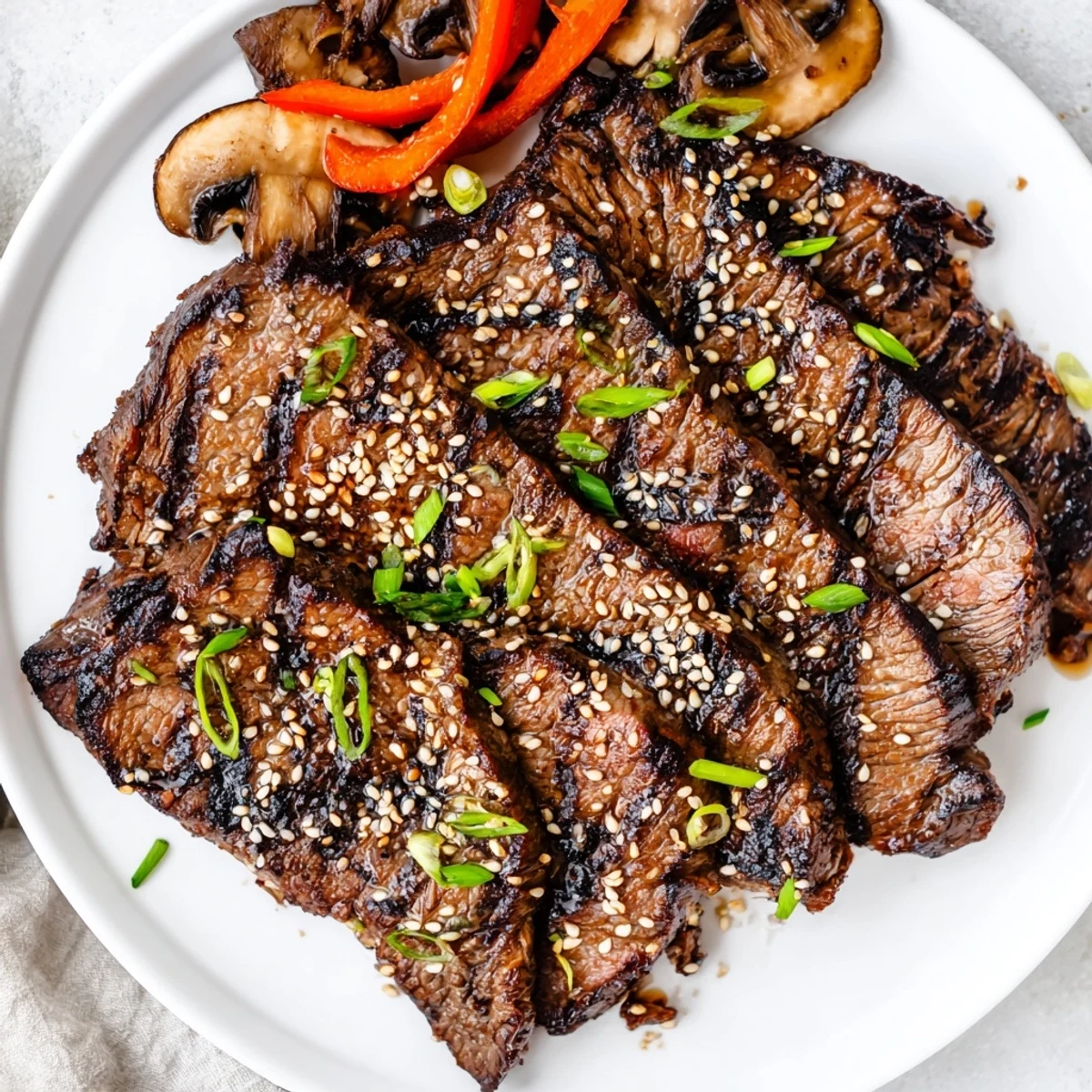 Thinly sliced Beef Yakiniku caramelized to perfection alongside colorful bell peppers and zucchini