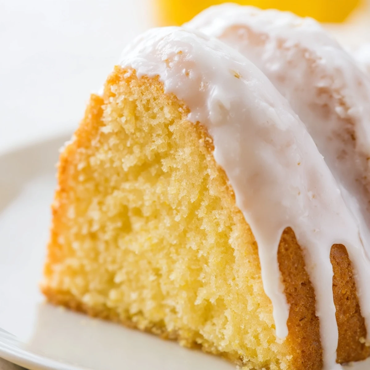 Classic Church Cake displayed in baking pan with sweet powdered sugar icing dripping