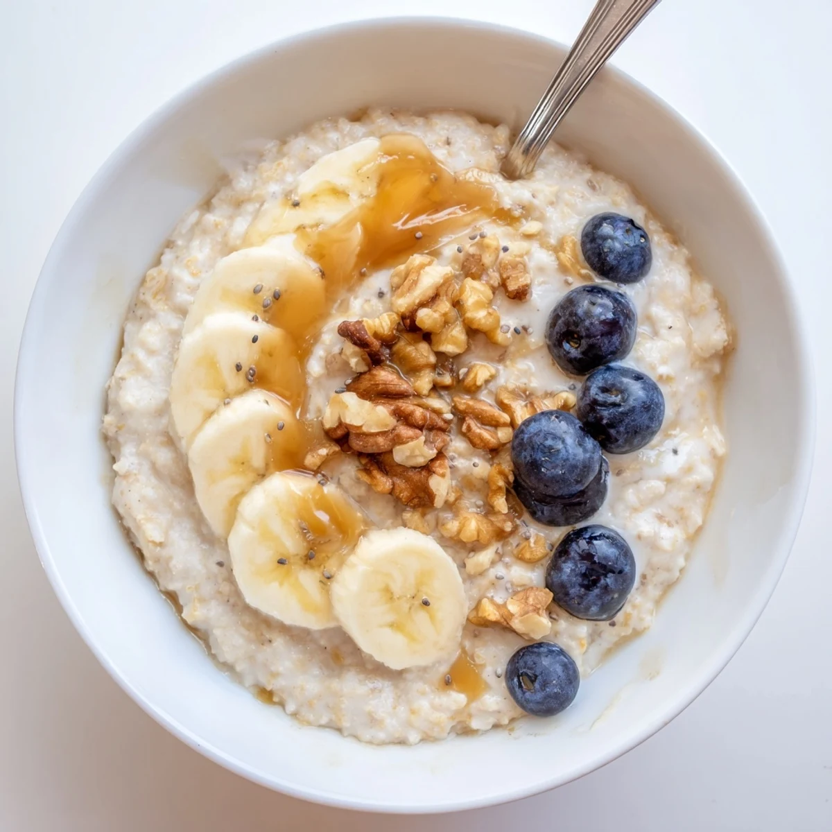 Hearty Protein Oatmeal stirred smooth with maple, nuts, and chia