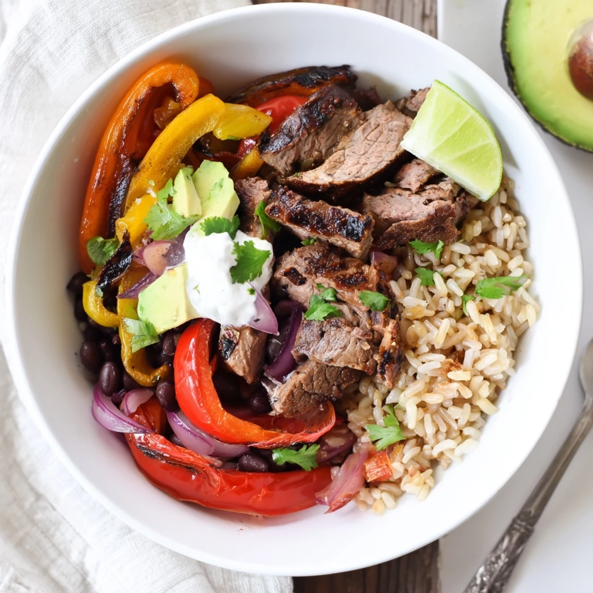 Colorful Steak Fajita Power Bowls: rice, black beans, warm spices, lime  