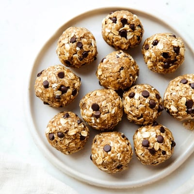A plate of No Bake Peanut Butter Energy Bites ready to serve, perfect for a quick afternoon snack.